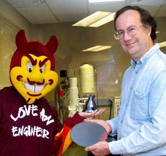 ASU materials science and engineering professor James Adams and ASU Sun Devils mascot Sparky display new materials in a university research lab. Photo: Jessica Slater/ASU