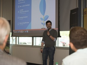 Dallas Grantham, ASU alumnus and co-founder of Tech Dispatcher, a service dedicated to providing hassle-free tech support to homes and businesses alike at the push of a button, pitches to a group of investors and a panel of judges at the Arizona Collegiate Venture Competition at the Arizona State University Innovation Center at Skysong, April 8, 2016. Photographer: Hayden Taylor/ASU 