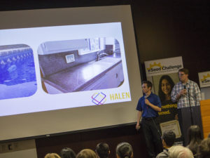 Software engineering student Kevin Hale, left, and Grayson Allen, a manufacturing engineering student pitch their startup, Halen, to a panel of judges at eSeed Demo Day, November 30, 2016. Their company aims to use the Internet of Things to develop pool sensors to detect drowning and alert homeowners through a mobile app. Photographer: Marco-Alexis Chaira/ASU 