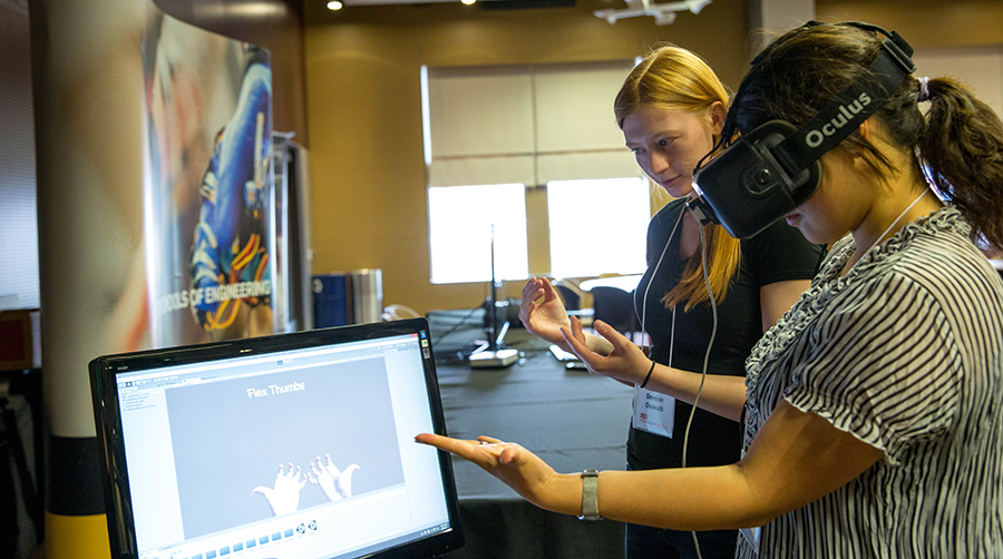 At the fifth annual Rehabilitation Robotics Conference, Denise Oswalt demonstrates a virtual reality application from the lab of Bradley Greger, an ASU researcher who specializes in neural engineering.