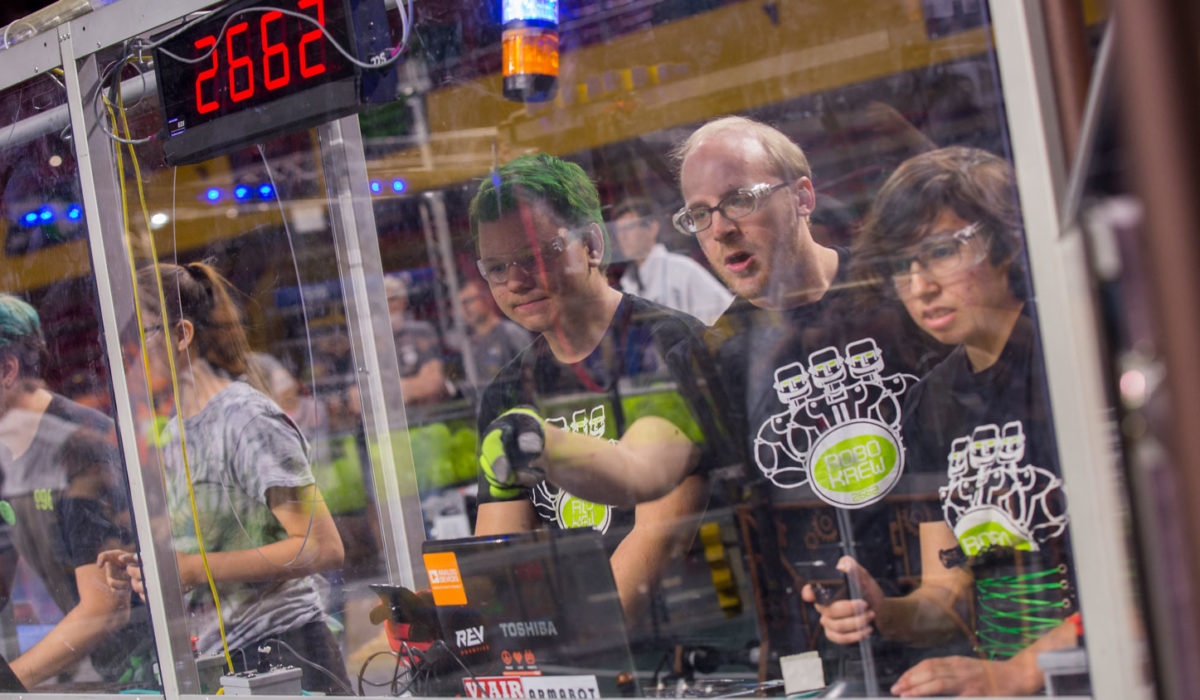 Student drivers guide their robot at the FIRST Robotics Competition Arizona State Championship at Wells Fargo Arena.