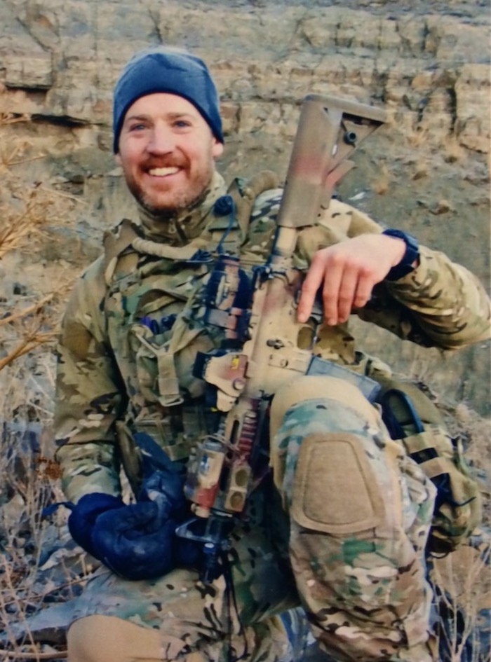 Photo of Carl Harris in combat gear on duty. Caption: Carl Harris has been on active duty or reserve status for the U.S. Navy for the past 18 years, with multiple deployments on missions in countries throughout the Middle East. He says he may stay associated with the military as a contractor as he begins a new career after earning an engineering degree online from the Ira A. Fulton Schools of Engineering. Photograph courtesy of Carl Harris.