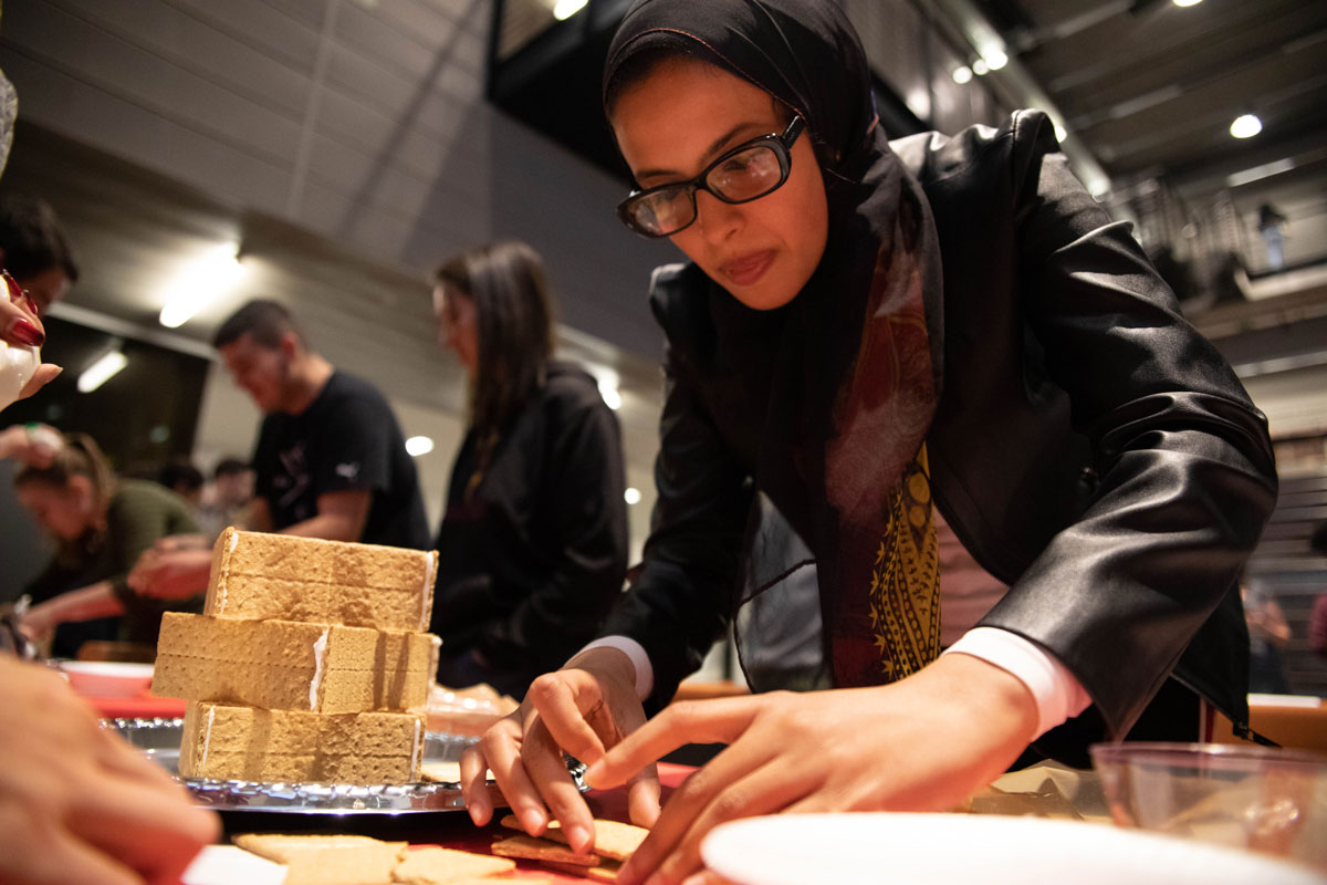 student building gingerbread house