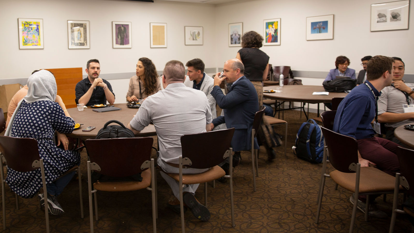 IEEE Brain 2019 Neurotech Entrepreneurs Workshop participants sit at tables.