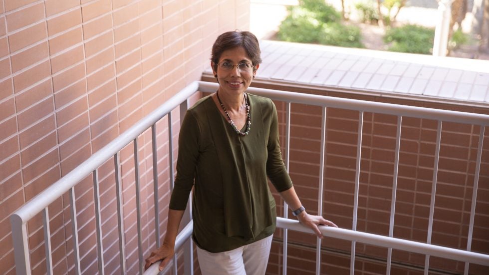 Chaitali Chakrabarti poses in the stairwell of the Goldwater Center