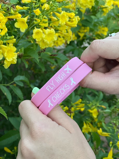 a pair of pink wristbands in memory of Mary Niemczyk