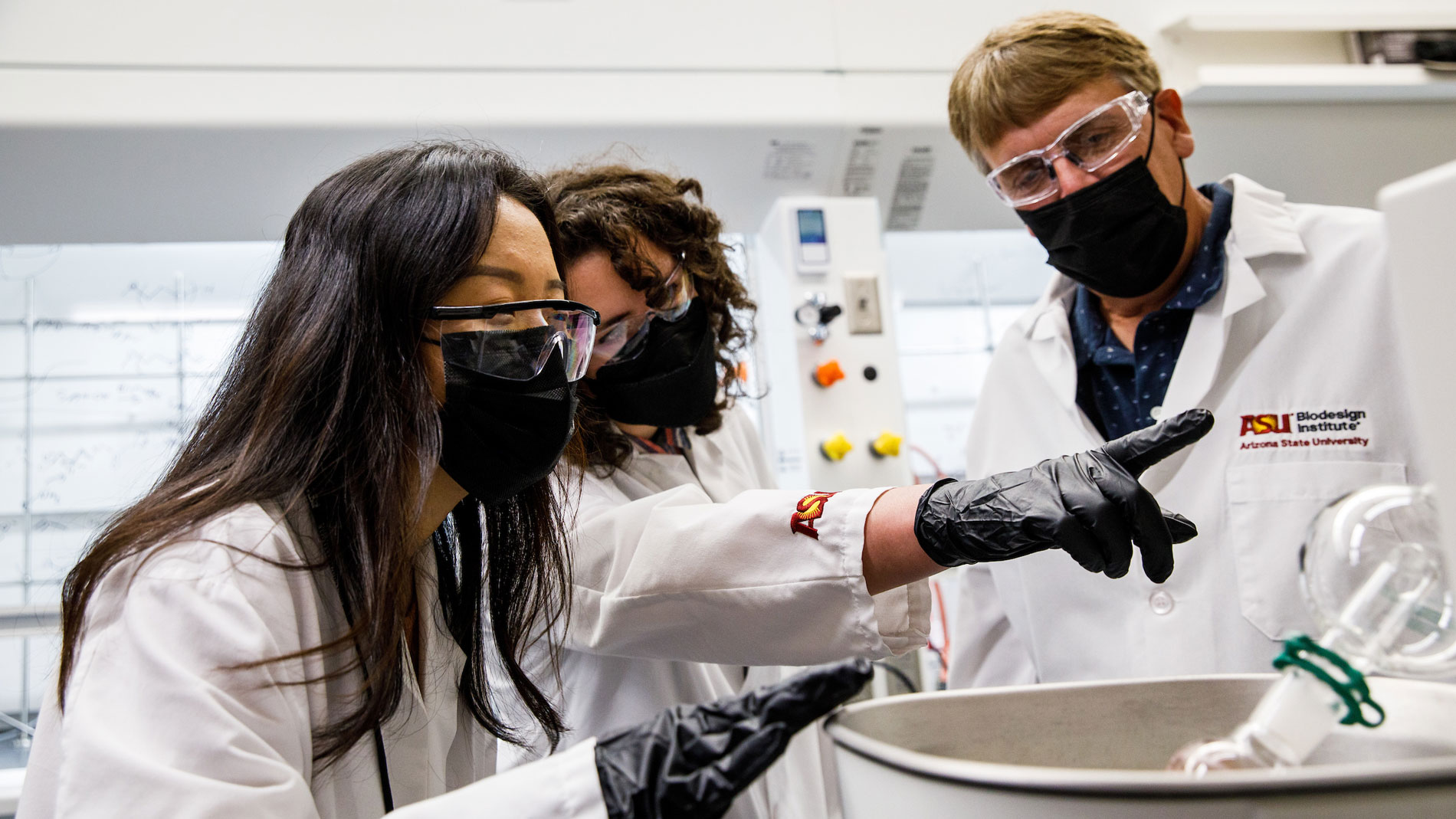 Graduate researchers Boer Liu and Clarissa Westover work with Professor Timothy Long in the ASU Biodesign Center for Sustainable Macromolecular Materials and Manufacturing.