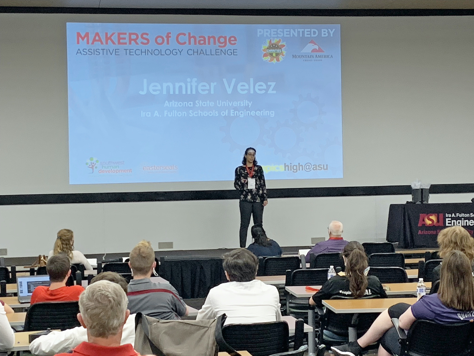 Jennifer Velez speaking in front of a group