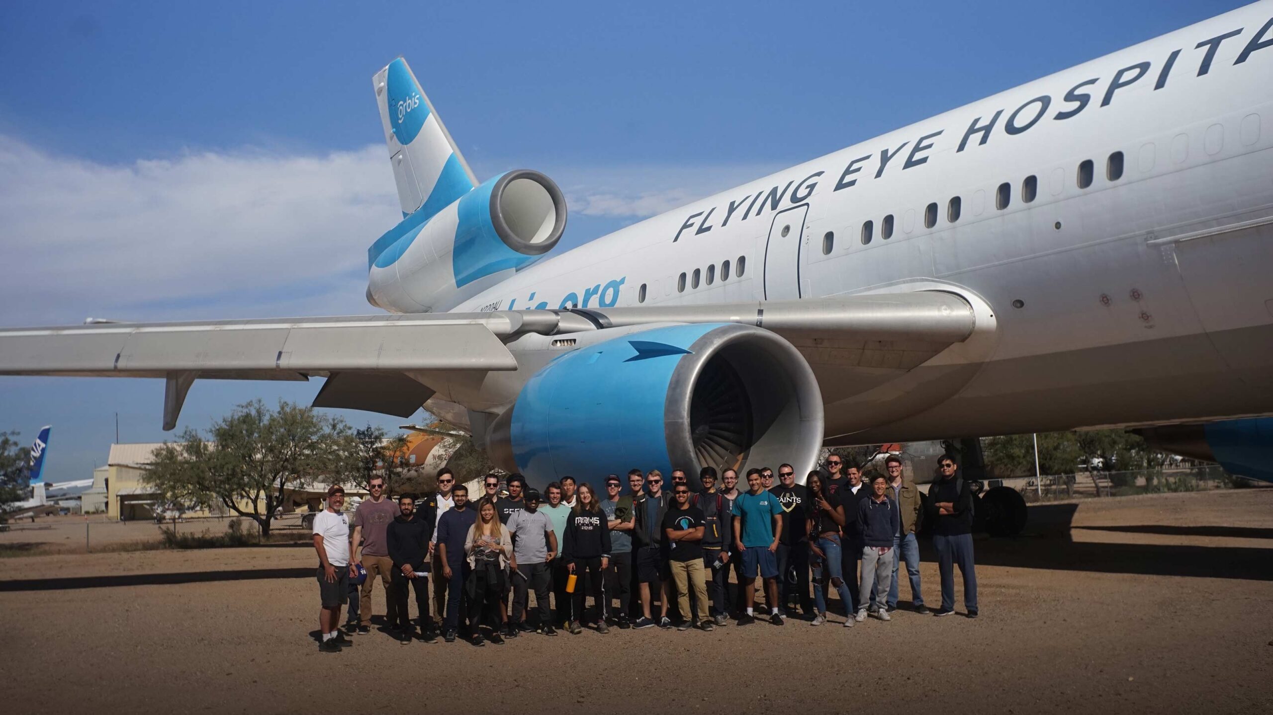 photo of Air Devils student group next to an airplane on a field trip to the Pima Air & Space Museum in 2018