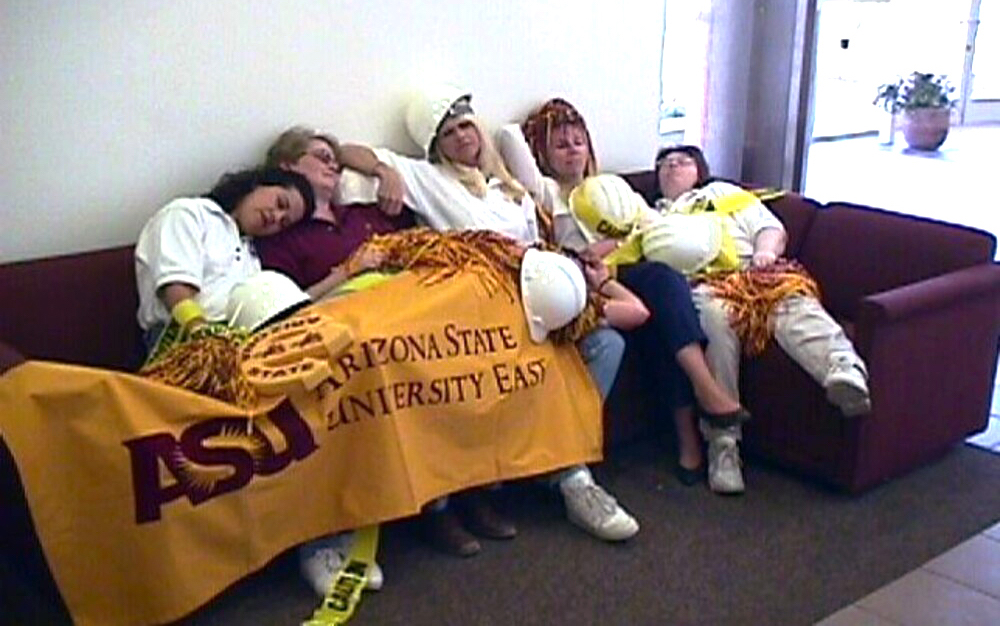 archival photo of Anna Wales and colleagues on a couch with an ASU banner