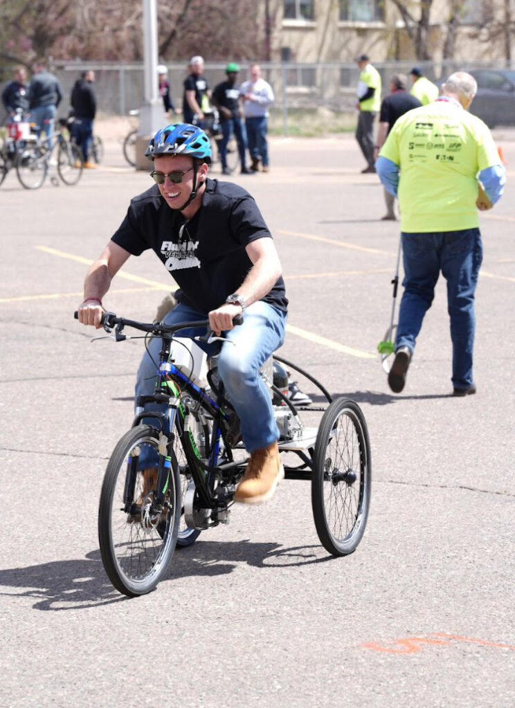 Matthew Seddon, team captain and student in the mechanical engineering systems program, riding a human-powered trike at the Fluid Power Vehicle Challenge competition in Littleton, Colorado.