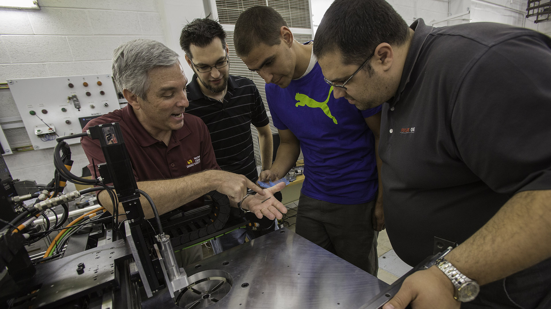 Lecturer Jerry Gintz teaches students about manufacturing processes