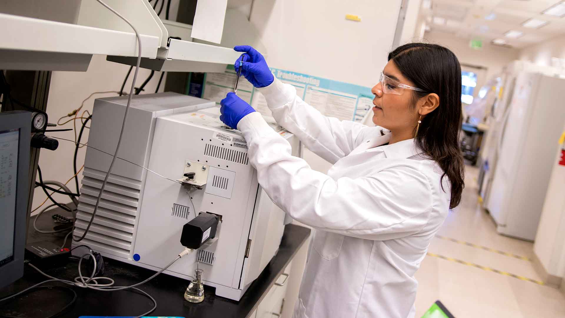 Aide Robles working in a lab