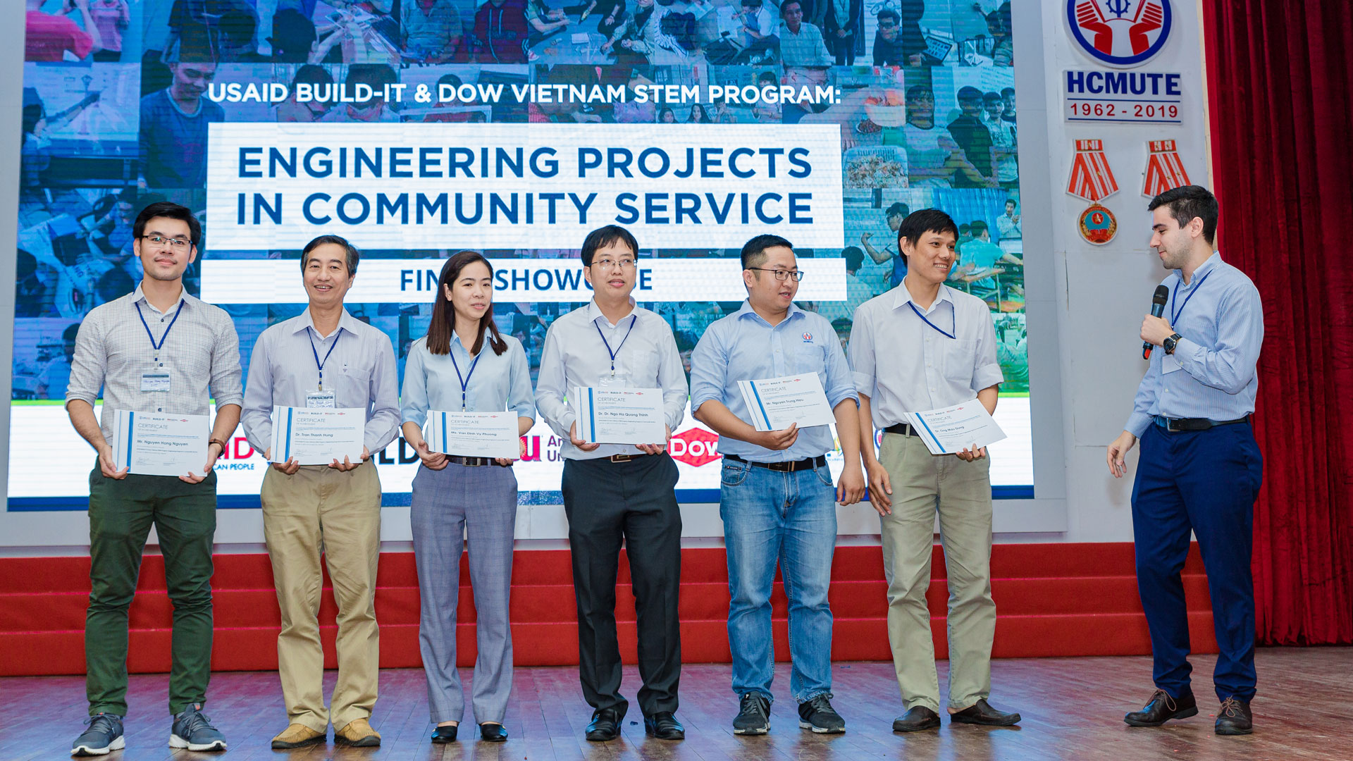 ALT TEXT: Van Dinh Vy Phuong (pictured third from left) participates with her teammates in the final showcase of the Engineering Projects in Community Service program, also known as EPICS.