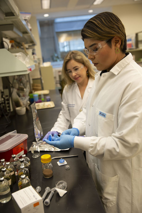 Anca Delgado and student in lab