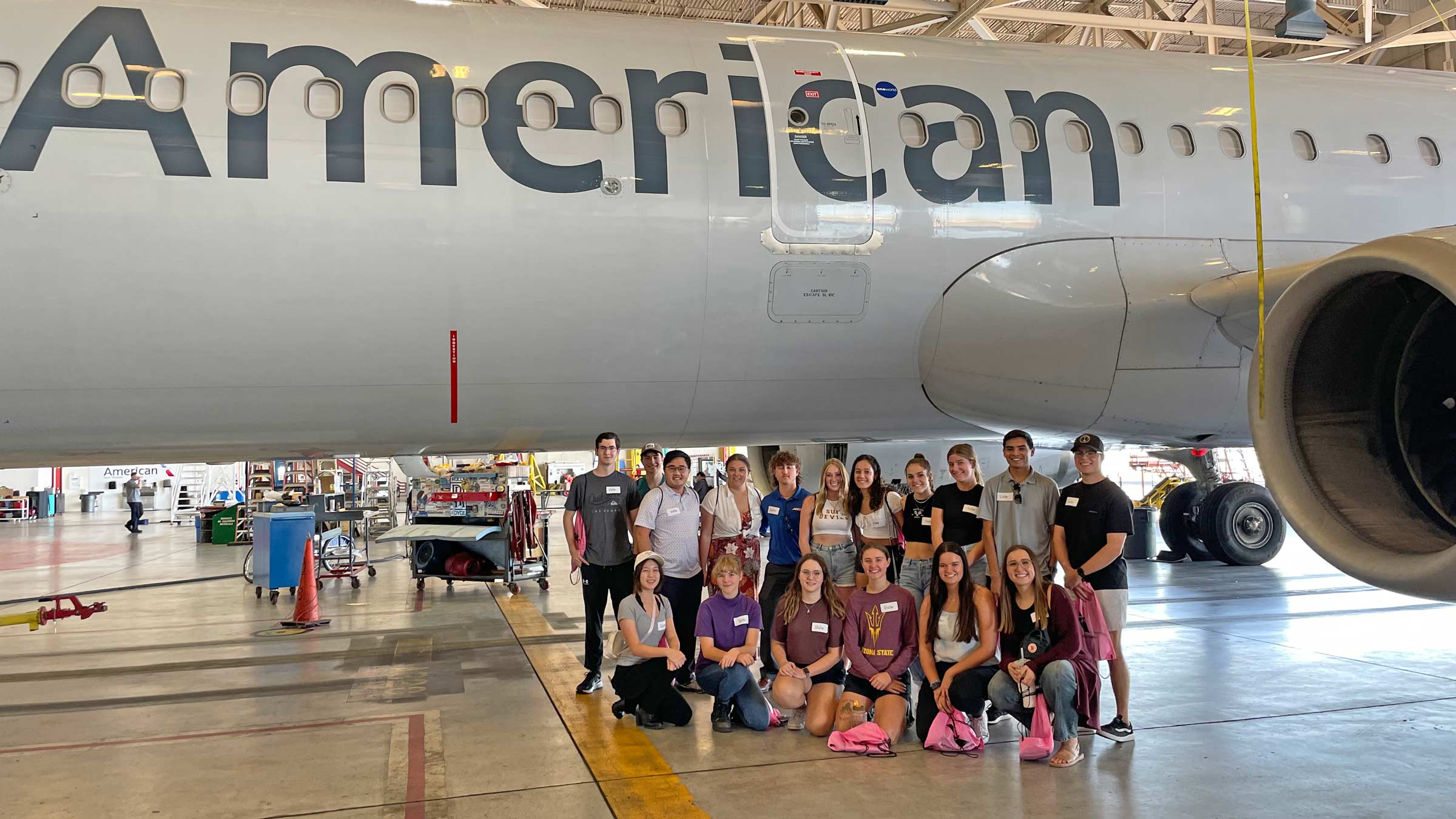 members of ASU's Women in Aviation student org in front of an airplane
