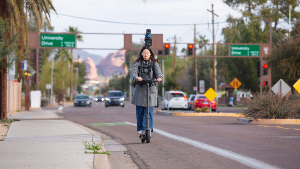ASU graduate student Chialing Wei rides an electric scooter while collecting lidar data.
