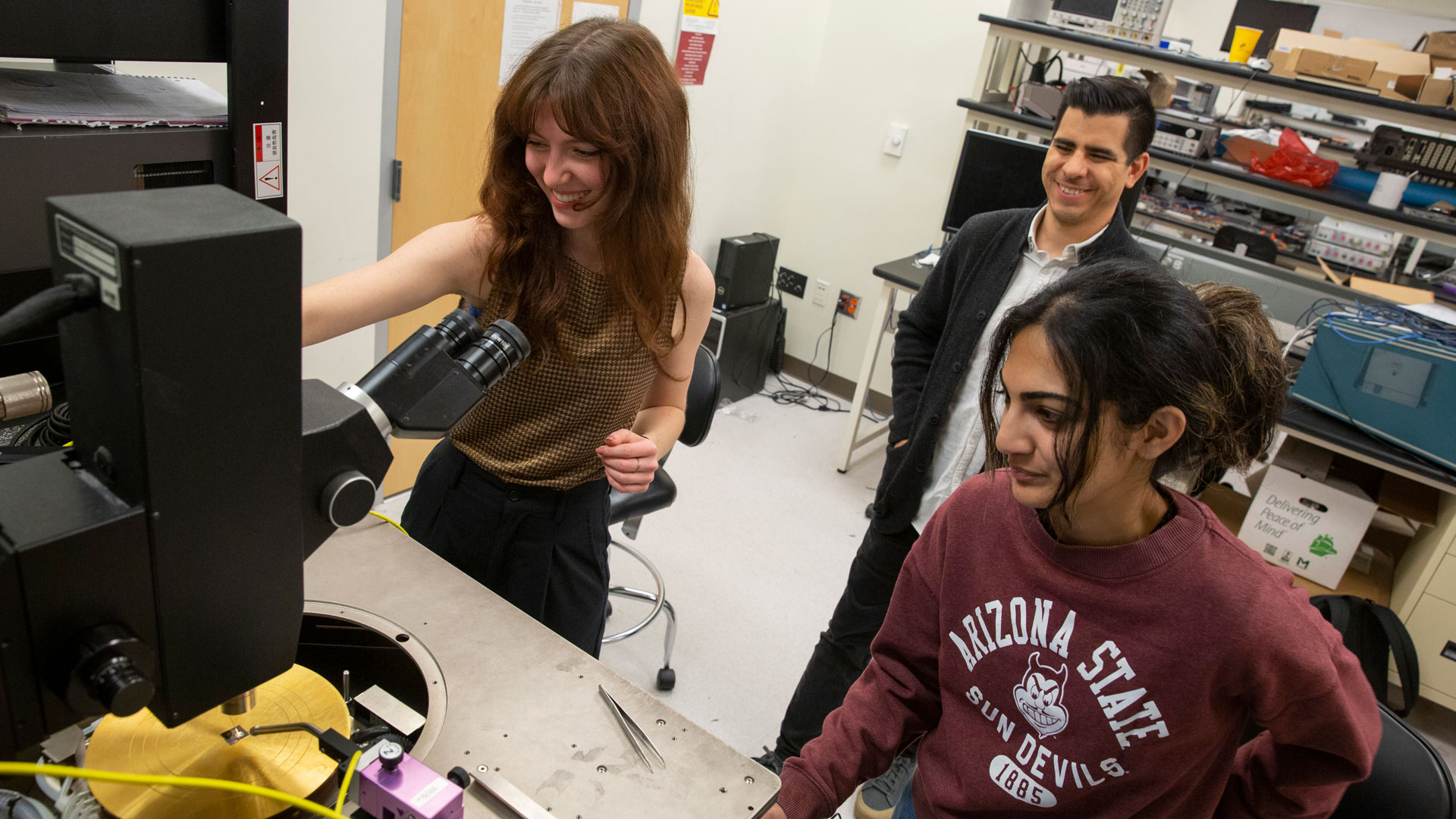 Hailey Warner (left), an electrical engineering junior, and Priyanka Ravindran (right), an electrical engineering senior, work on semiconductor-related research projects in the FURI program under the mentorship of Ivan Sanchez Esqueda (middle), an assistant professor of electrical engineering. 