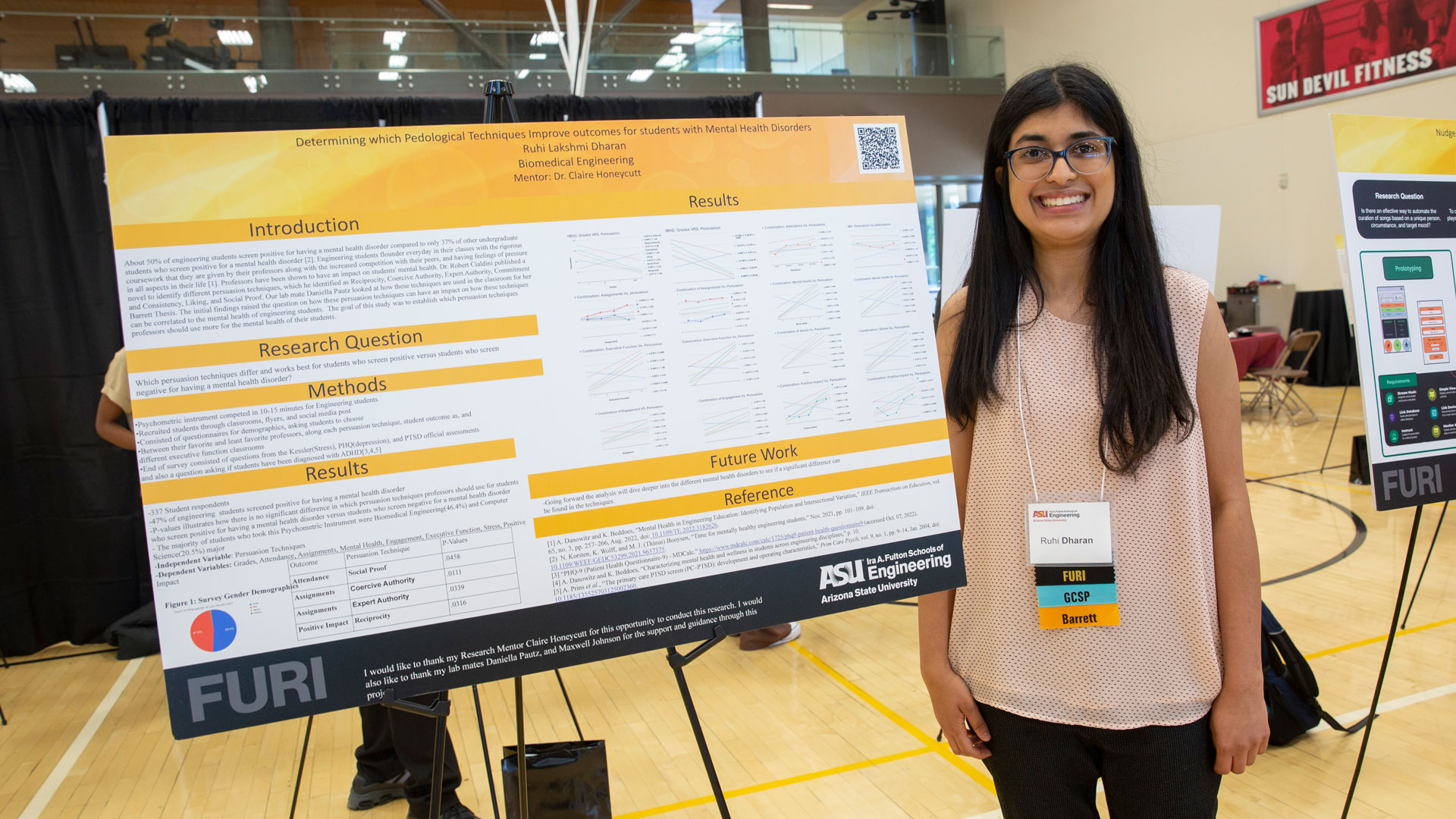 ASU biomedical engineering undergraduate student Ruhi Dharan poses with a research poster presenting her Fulton Undergraduate Research Initiative project findings.