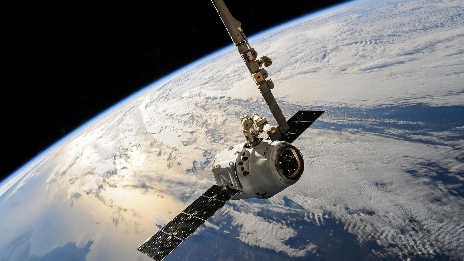 A satellite is shown in space above Earth.