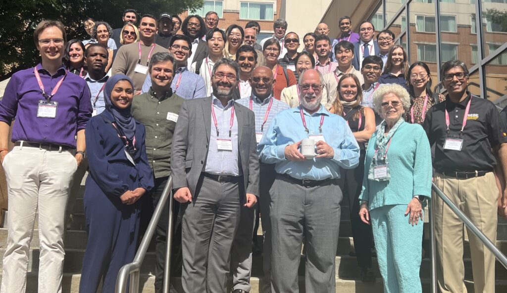 A large group of TOMNET researchers posing for a photo