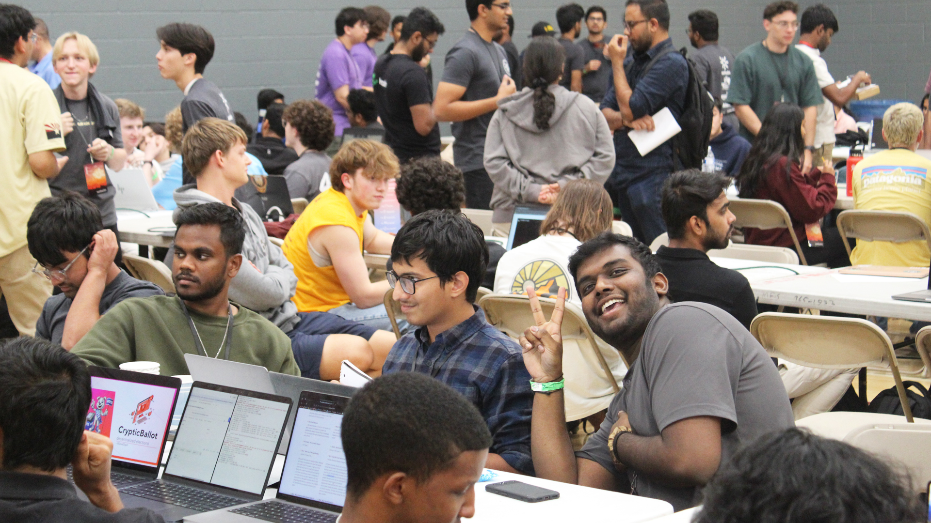 A large group of students work on projects during the sunhacks hackathon at ASU.