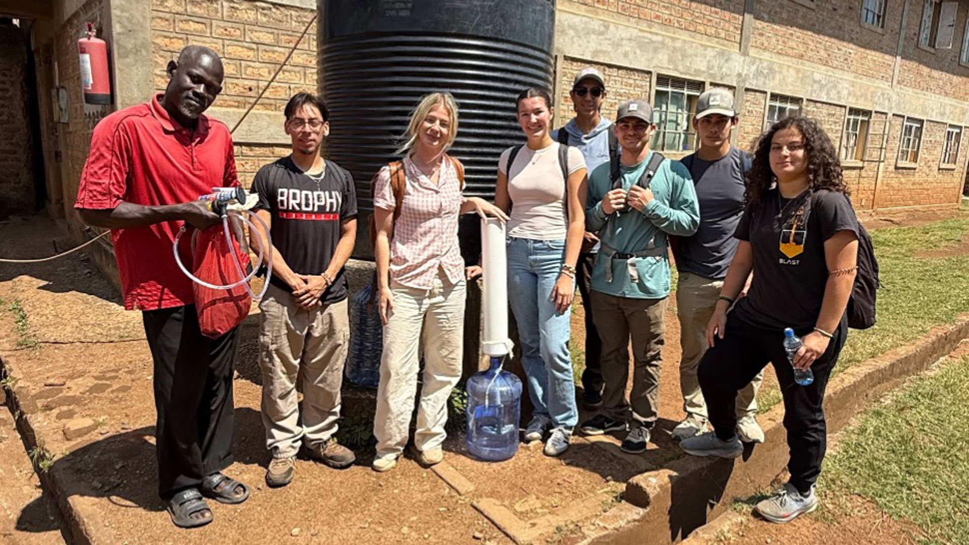 Picture2w Students posing with water filtration system in Kenya