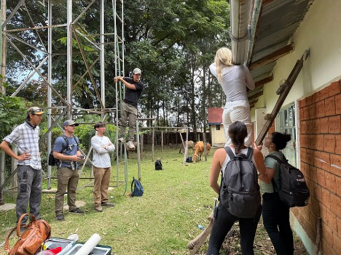 students in Kenya working on a building