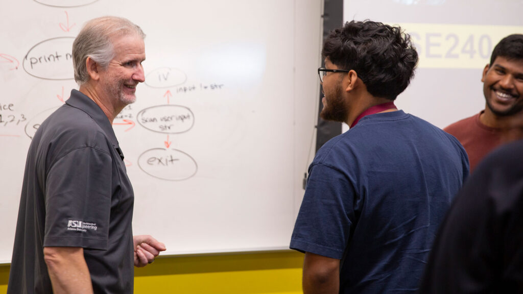 Erik Trickel with students